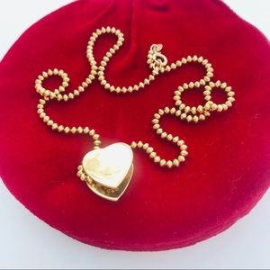 Sterling silver and gold double heart necklace.